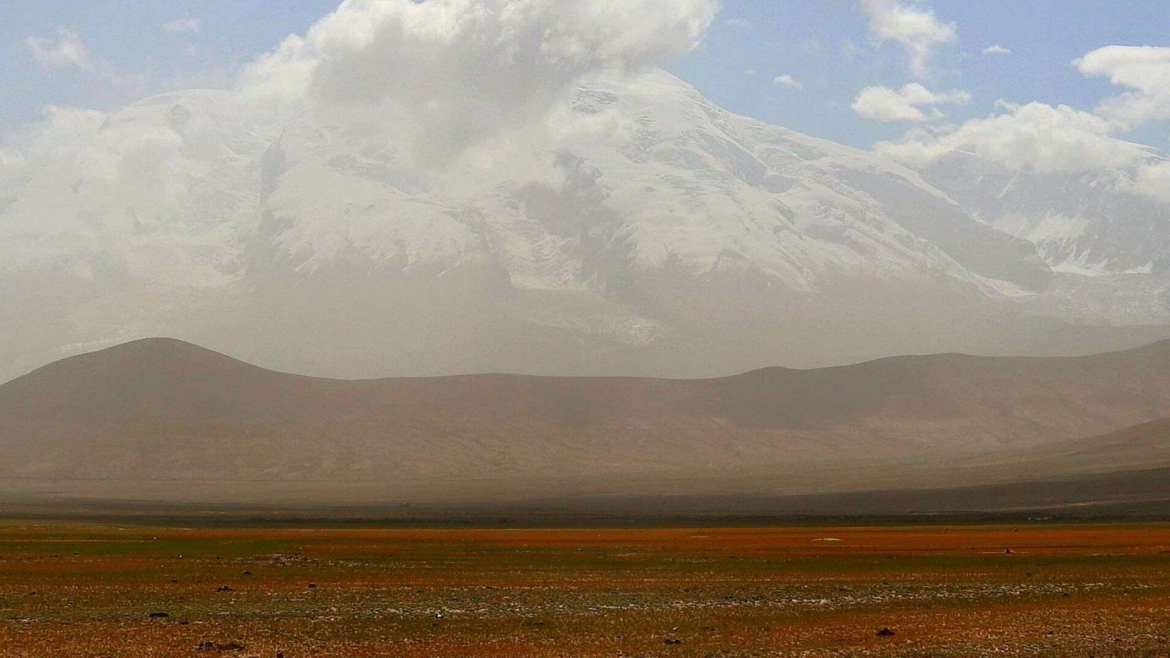 Travel on the Karakoram Highway in Xinjiang, China- Muztagh Ata in the dusty mist