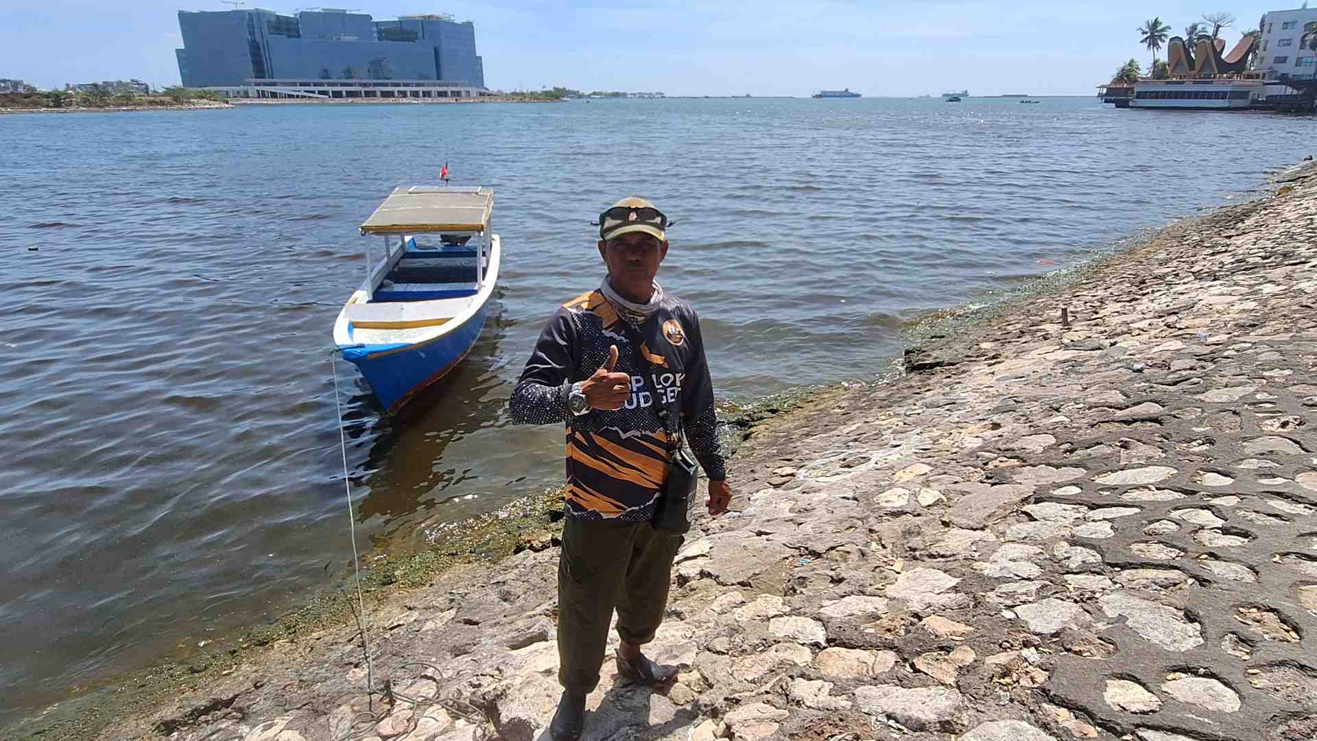 Our boat captain with his boat for the trip to Samalona and Kodingareng Keke