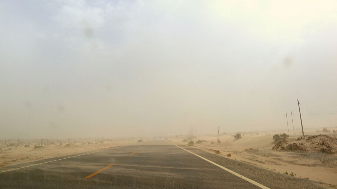Sand storm on a desert road