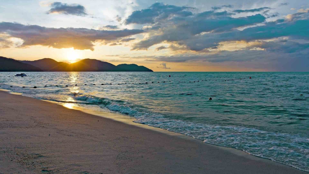 A beach on Penang Island at sunset