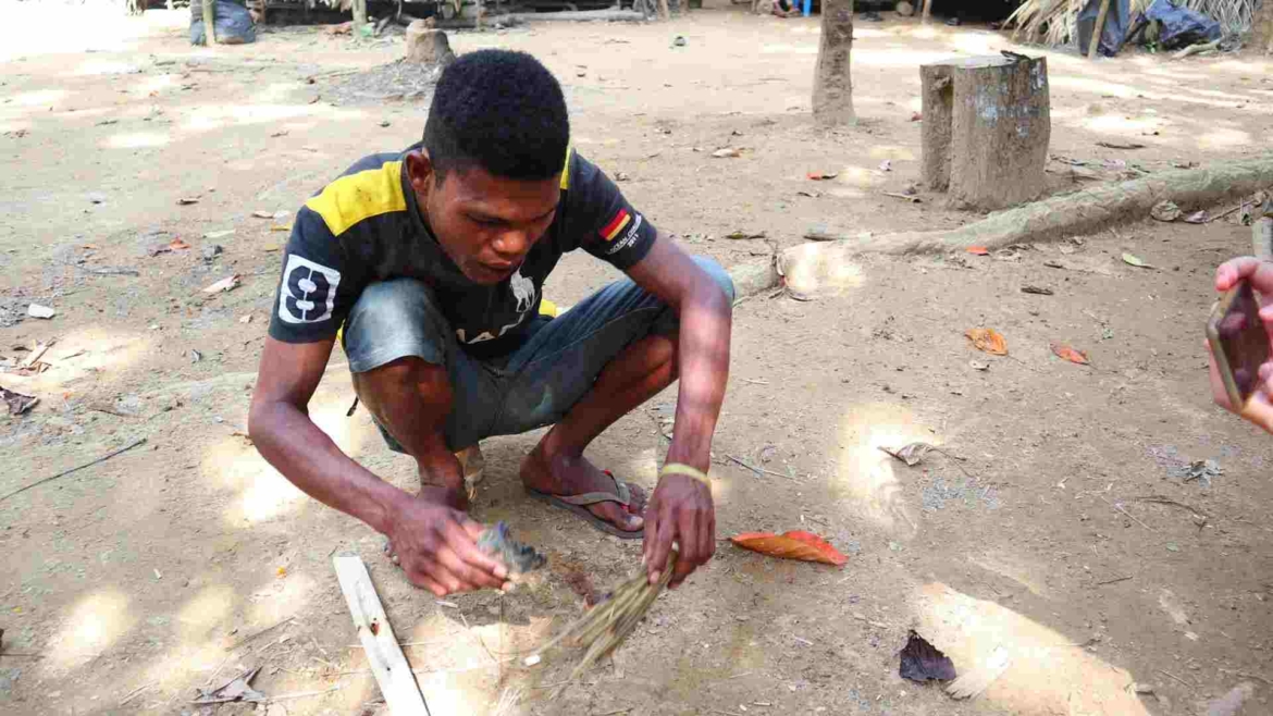 A man of Batek making fire