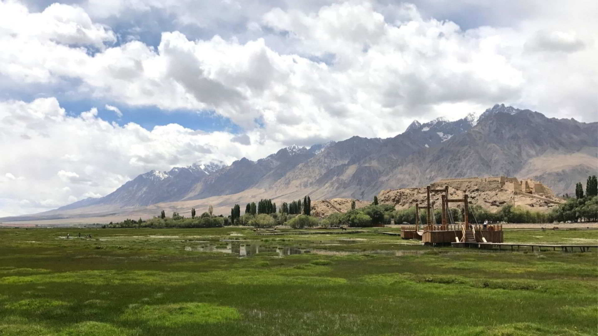 Travel on the Karakoram Highway in Xinjiang, China- the border with Tajikistan is on the mountains